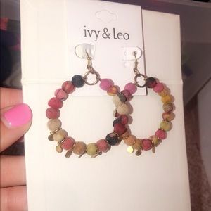 Multicolored cloth, gold studded hoops